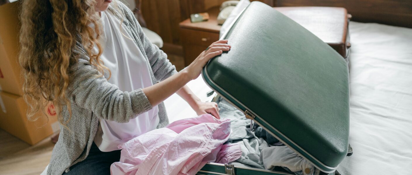 woman packing a suitcase